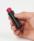 Person holding a 19mm Retractable Table Stop For Woodworking with black metal body and red top, Compact Workbench Accessory