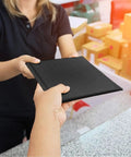 Handing over Black Bubble Mailers 6x10 Inch Outer, Usable 6x9 Inch, 4.6mm Thick Waterproof Padded Envelopes For Shipping in a store