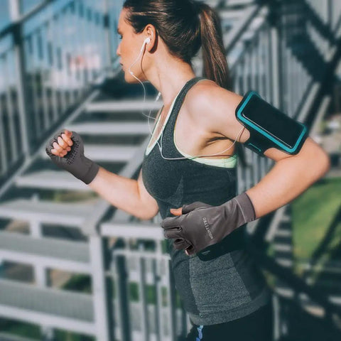 Woman running wearing Men's Breathable Summer UV Protective Fingerless Gloves UPF 50 Plus Stayin' Cool Sunblock, charcoal, size large.