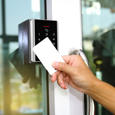 Rock Solid Stand Alone Door Access Control Keypad With 125 Khz Proximity Reader And Password Code Combo Including Five Heavy Duty Key Fob Tags For Bulletproof Gate Opener Security And No Fuss Install, hand using card.