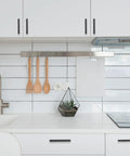 White kitchen with 10 Pack 5 Inch Matte Black Kitchen Cabinet Handles Knurled Cabinet Pulls visible on cabinets and drawers.