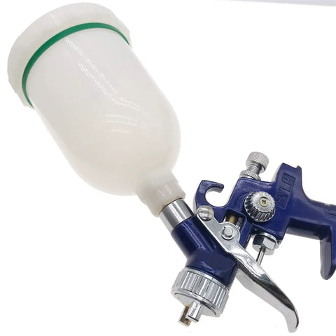 Heavy Duty 300ml Plastic Spray Airbrush Pot With Threaded Fitting For HVLP Gravity Fed Mini Paint Guns And Pneumatic Tools, shown attached to an airbrush.