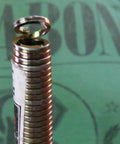 Close-up of Rack-A-Tiers Pipe Viper Cold Bend Tool for half inch Schedule 40 PVC conduit, showing coil design.