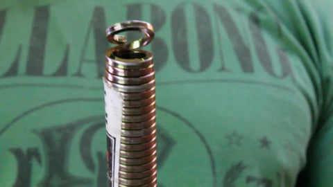 Close-up of Rack-A-Tiers Pipe Viper Cold Bend Tool for half inch Schedule 40 PVC conduit, showing coil design.