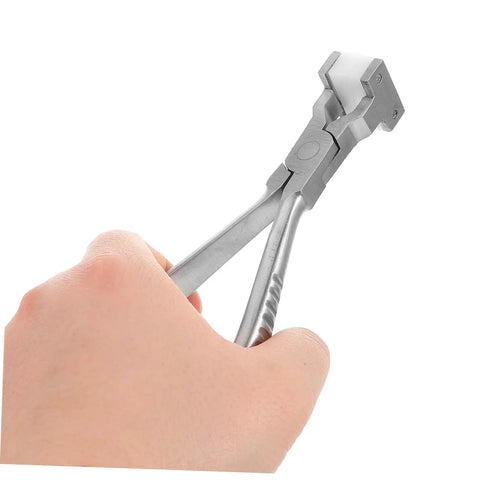 Hand holding silver Eyeglass Adjustment Pliers for Nose Pad Screws Quick Fix Tool for Tightening Screws Precise Repairs for Sunglasses