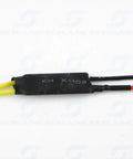 Close-up of yellow and black wires connected to a black electronic component labelled KH K-102, against a white background.