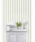 Premium Green Stripes Wallpaper With Heavy Duty Matte Finish And Natural Linen Texture Designed For Homes And Commercial Spots Featuring Pvc Free Composition And Quick Paste To Paper Setup That Totally Slaps on a bathroom wall with towels and mirror.