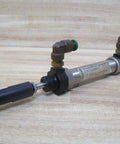 Industrial Hydraulic Cylinder 10mm Bore With Two And One Half Inches Stroke PN 13316050001 on wooden background