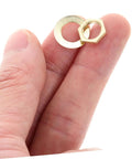Close-up of washers and locknut from Gold 14 Piece DIY Clock Parts Kit For Metal Quartz Clock Repair in hand
