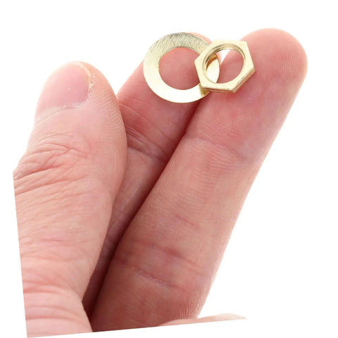 Close-up of washers and locknut from Gold 14 Piece DIY Clock Parts Kit For Metal Quartz Clock Repair in hand