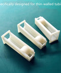 Set Of 4 Silicone Tubing Clamps With Fingertip Adjustable Flow Control shown on table, durable and lightweight for precise regulation of liquids.