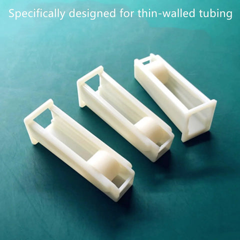 Set Of 4 Silicone Tubing Clamps With Fingertip Adjustable Flow Control shown on table, durable and lightweight for precise regulation of liquids.