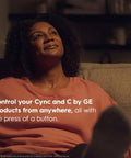 Person relaxing at home with text about controlling Cync and C by GE products remotely using a smart remote.