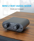Two Channel 3.5mm Stereo Mini Headphone Mixer with Dual Inputs and 3.5mm Aux Output on wooden table
