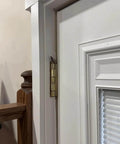 Magnetic Hinge Head T Rex Set Of 3 Miniature Door Topper Figures For Standard Hinges in installed view on white door