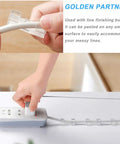 Hand using cable clip from four pack self adhesive power strip holders wall mount brackets with sixteen cable organizer clips clear finish