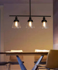 Dope 3 Light Farmhouse Black Kitchen Island Pendant Light With Clear Seeded Glass And Adjustable Rods in dining room
