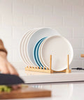 Top Shelf Bamboo Dish Drying Rack Stand with plates drying, natural bamboo design for kitchen counter organization.