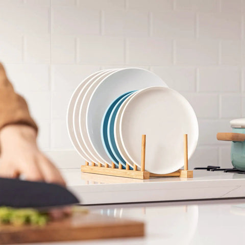 Top Shelf Bamboo Dish Drying Rack Stand with plates drying, natural bamboo design for kitchen counter organization.