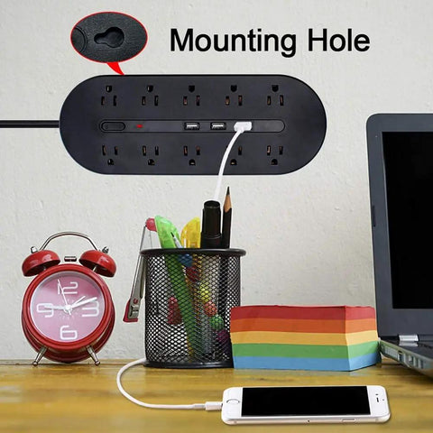 10 Outlet Power Strip With USB Ports And 1700J Surge Protector mounted on wall beside desk setup