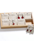 Retro Wooden Jewelry Organizer Tray With Eight Grids To Keep Your Bling Slick And Prevent Tangles While Displaying Necklaces And Earrings On Any Desk Surface with red earrings.