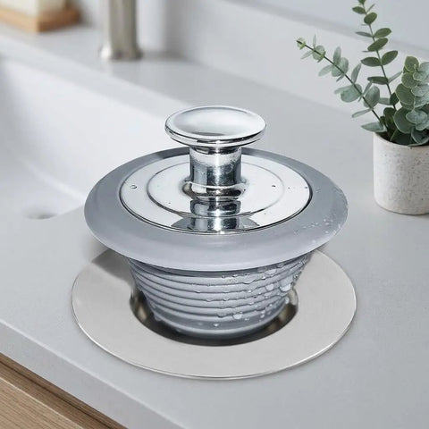 GLSTOY Bathtub Drain Plug Hair Catcher Chrome Plated Metal Silicone on white countertop with water droplets.