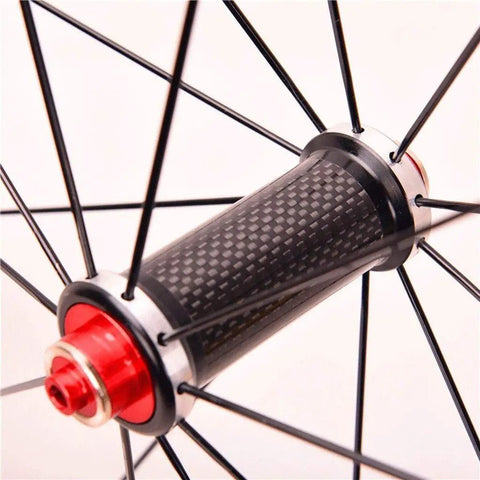 Close-up of carbon fiber hub on Road Bike Wheelset 700C With Carbon Fiber Hubs, Dope Double Wall Alloy Rims, featuring red accents
