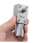 Heavy Duty 12V DC Worm Geared Motor Delivers Badass Torque And Smooth Adjustable Speed Up To 160 RPM handheld view with metal housing.