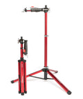 Pro Mechanic HD Bike Repair Stand With 360 Degree Clamp Beefy Heavy Duty Aluminum Build Tripod Base Lightweight Yet Steady Supports Up To 100 Lb Bikes And E Bikes Red displayed in folded and expanded positions