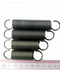 Heavy Duty Stainless Steel Tension Extension Springs, High Strength 65Mn Metal Coils arranged in a stack, with visible hooks.
