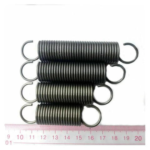 Heavy Duty Stainless Steel Tension Extension Springs, High Strength 65Mn Metal Coils arranged in a stack, with visible hooks.