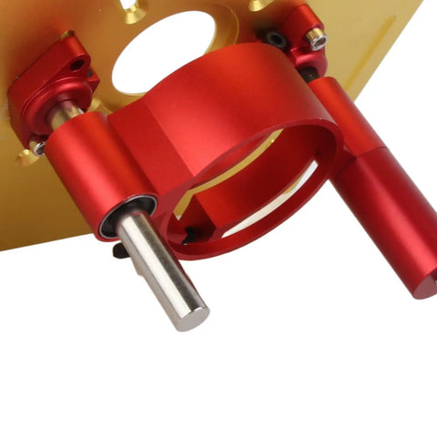 Heavy Duty Aluminum Router Lift For Top Shelf Woodworking Tables Featuring Smooth Manual Crank 0 To 47 Mm Height Adjustment and Boss Tier Clamping Base In Clean Gold Finish close-up of red clamping components.