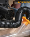 Flexible 2.5 Inch Dust Collection Hose With Left Spiral Design connected to woodworking equipment in a shop setting