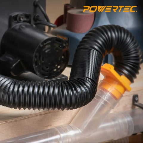 Flexible 2.5 Inch Dust Collection Hose With Left Spiral Design connected to woodworking equipment in a shop setting