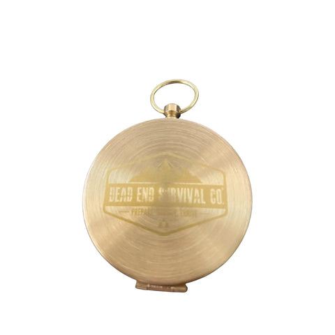 Back view of closed Military-Grade Glow In The Dark Brass Compass For Outdoorsy Types, showing brass finish and loop