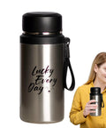 Insulated Water Bottle For On The Go Hydration 800ml Stainless Steel Flask with black lid, held by person in yellow shirt