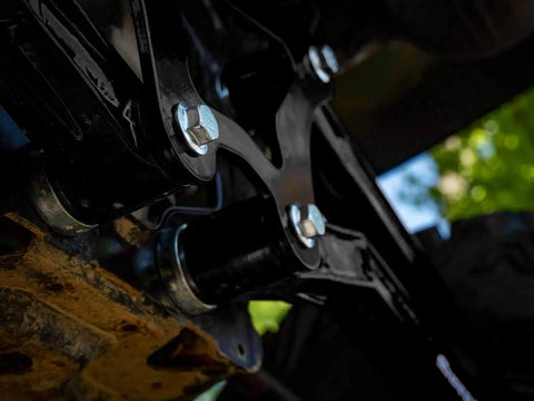 High Clearance Boxed Rear Radius Arms Beefed Up For Polaris RZR XP 900 And XP 4 900 2011 To 2014 Black Finish Heavy Duty Welded Strength Upgrade For Tough Trails And More Maneuverability close-up installed with bolts