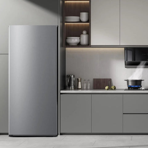 No Sweat 21 Cubic Foot Upright Convertible Freezer And Refrigerator With Built Tough Stainless Steel Exterior in modern kitchen setting.