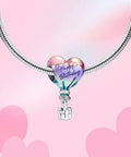 Happy Birthday Hot Air Balloon Charm In 925 Sterling Silver With Enamel Heart Balloon on bracelet, pink background
