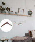 Built Like A Tank Walnut Wood Corner Shelf Brackets For Wall Mounted Displays Heavy Duty Support Braces displayed near shelf.