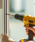 Person installing Heavy Duty Commercial Door Astragal Weatherstrip 2 Pack 42 Inch Tight Gap Seal Gasket with power drill.