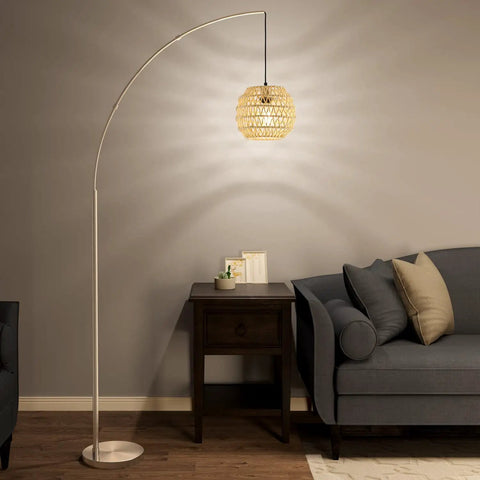 Modern Arc Floor Lamp With Rope Linen Shade in a living room next to a sofa and table, brushed steel design