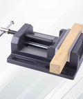 Heavy Duty Beefy 6 Inch Drill Press Vise For Precision Workholding, 30 Lb Clamp With Sturdy Jaw, in use securing a wooden piece