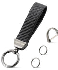 Premium Leather And Slick Carbon Fiber Keychain Featuring An Anti Lost D Ring With Two Extra Key Loops Made From Tough Zinc Alloy Hardware For Secure Daily Carry Or Glove Box Setup In Classic Black, showing keychain with carbon fiber strap and zinc alloy rings.
