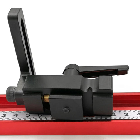 Aluminum Stop Block for Miter Track and 45 Type Positioner on red measuring track, side view for woodworking precision