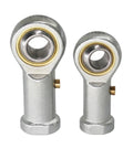 Two alloy steel ball joint rod end bearings showing precision left hand thread and female ends, part of Ten Piece Set Of Three Quarter Inch Alloy Steel Ball Joint Rod End Bearings With Precision Left Hand Thread And Female Ends Built Tough For Garage Mods And Suspension Upgrades That Roll Smooth.