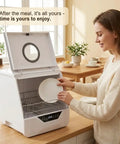 Woman placing a plate in a Portable Countertop Dishwasher With 360 Swishing Spray And Crisp Led Interface Nifty Compact Mini Cleaner.