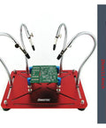 Helping Hands Soldering Stand With Four Gooseneck Arms And PCB Holder For Electronics Jewelry And Hobby Crafts Pro Grade Third Hand Tool With Non Slip Base For Soldering Assembly And Repairs, red base, PCB shown in holder.
