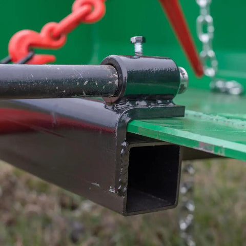Close-up of Hay Bale Spear Frame Attachment with chain detail for Universal Front Loader Buckets. Heavy Duty 3000 Lb Capacity.