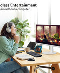 Person using 27 Inch Smart Monitor With WebOS For Streaming TV And Gaming Bluetooth Wireless Projection Screen Mirroring IoT Hub